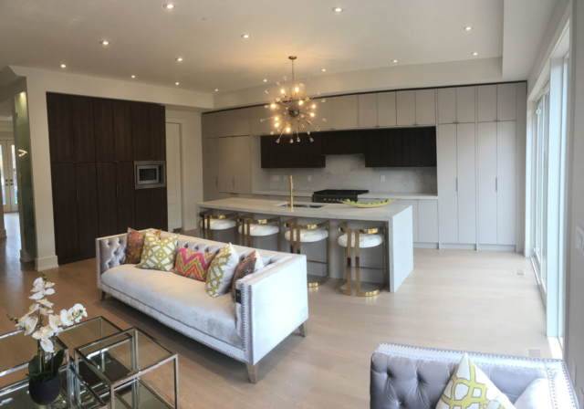 Modern Kitchen With Austrian Laminate, Quartz Countertops And Waterfall Center Island