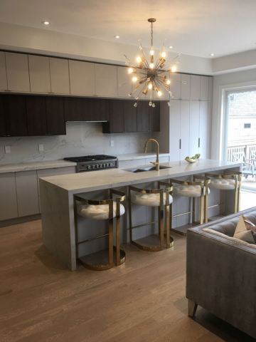 Modern Kitchen With Austrian Laminate, Quartz Countertops, And Waterfall Center Island