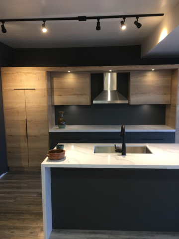 Modern Kitchen With Austrian Laminated Doors Quartz Countertops And Waterfall Island