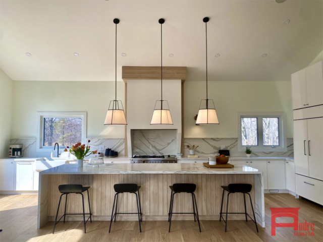 Modern Kitchen With Painted Mdf And Austrian Laminate Waterfall Island With Quartz Countertop Quartz Backsplash And Mantle Hood